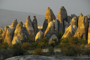 Tufa formations in the evening light, Goreme National Park, Göreme, Nevsehir Province, Cappadocia,...
