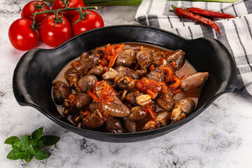 Baked chicken hearts with vegetables