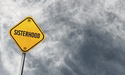 Sisterhood, yellow sign with cloudy sky