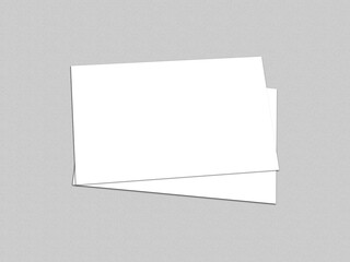 Two overlapping blank white business cards on a gray background, White blank business card on background