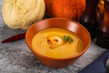 Pumpkin cream soup with prawns