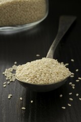 White Sesame seeds on a spoon