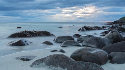 Rocks on the beach, sunset, Unstad, Lofoten, Norway, Europe