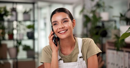 Woman, florist and happy for phone call at store with contact, listen or deal with compost supplier. Person, smartphone and smile for conversation, negotiation and order for organic plants at shop