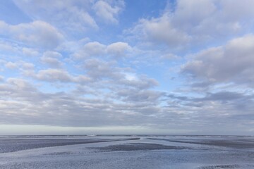 Fototapeta premium Low tide in the Lower Saxon Wadden Sea National Park, Langeoog Island, East Frisia, North Sea Coast, Lower Saxony, Germany, Europe