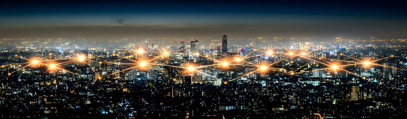 Obraz premium Night city network, aerial view, glowing