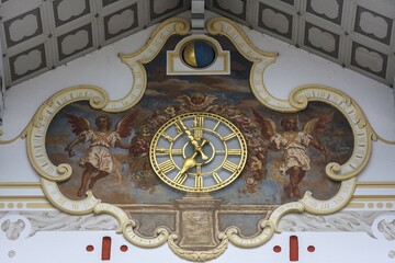 Clock, city hall clock framed by frescoes, Town Hall, Bad Tölz, Upper Bavaria, Germany, Europe
