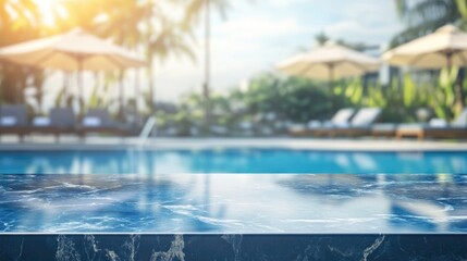 Empty blue marble countertop on blurred background of swimming pool with sun loungers and parasols on sunny summer day