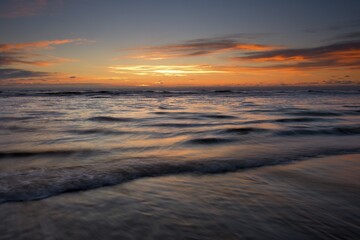 Fototapeta premium Sunset at the beach of the North Sea, Texel, North Holland, Netherlands