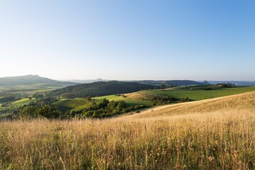 View of the volcanic landscape of the Hegau region with the mountains Hohenstoffeln, Hohenhewen and...