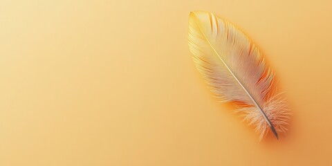 Naklejka premium Close-up of a single yellow feather on a smooth gradient background, showcasing intricate details and minimalist aesthetics.