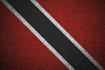 Fototapeta premium The Trinidad and Tobago flag painted on a cork board