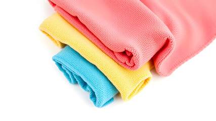 Rolled different microfiber cloths on white background, top view. Space for text. Generative AI