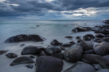 Rocks on the beach, sunset, Unstad, Lofoten, Norway, Europe
