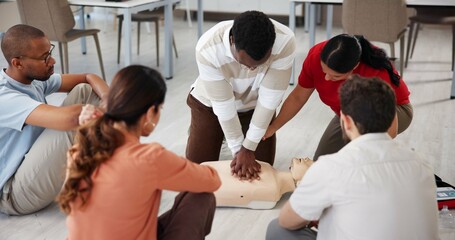 People, dummy and first aid in office for learning, CPR workshop or chest compression lesson....