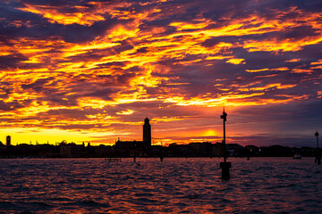 Fototapeta premium Stunning Venice Sunset with Fiery Clouds and Water Reflection