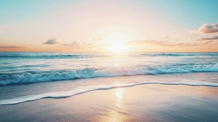Fototapeta premium A calm beach with soft waves and a sunrise reflecting on wet sand, creating a tranquil and serene atmosphere