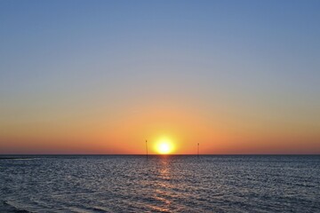 Setting sun over the North Sea at Norddorf, North Frisian island, North Frisia, Schleswig-Holstein, Germany, Europe