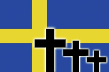 The Swedish flag and the silhouettes of tombstones crosses