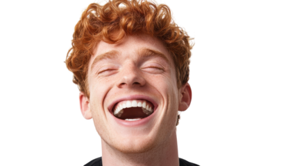 Young man with curly red hair laughing joyfully, showcasing an infectious smile against a plain background