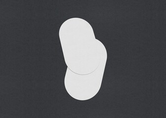 Two white oval sheets overlapping slightly on a dark background, Blank white Business card mockup stacks at grey textured paper background