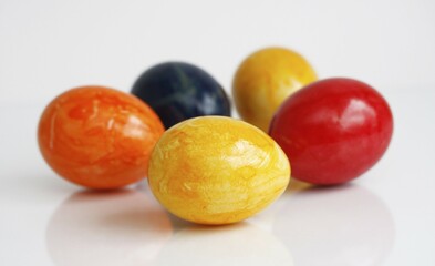 Painted Easter eggs on a glass surface