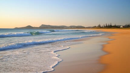 Obraz premium Serene waves lapping sandy beach sunrise coastal landscape tranquil environment peaceful view