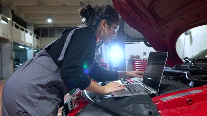 Female mechanic diagnosing car issues using a laptop in a clean and modern repair shop environment - Powered by Adobe