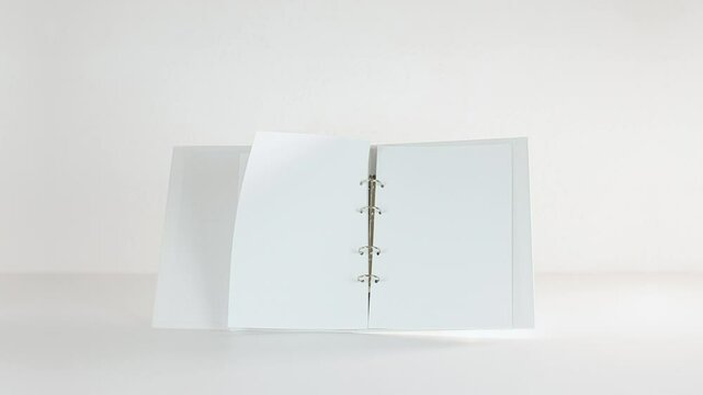 White Folder With Sheets Of Paper Flys and Turns Over In Stop Motion