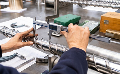 Professional quality control inspector conduct safety inspection on steel machinery and manufacturing process. Factory engineer or operator make