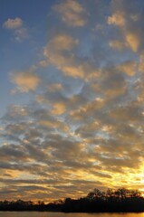 Sunrise with clouds at the lake in Menzelen, North Rhine-Westphalia, Germany, Europe