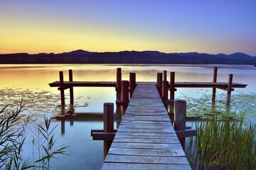 Wooden pier at sunrise on Pfäffikersee, Pfäffikon, canton of Zurich, Switzerland, Europe