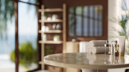 A round marble table features towels and bath products, set in a modern, brown bathroom.