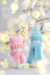 Happy snowmen under a sakura branches. Greeting card, Valentine's Day concept, lovers anniversary