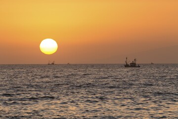 Trawler at sea, setting sun, Costa Adeje, Tenerife, Canary Islands, Spain, Europe