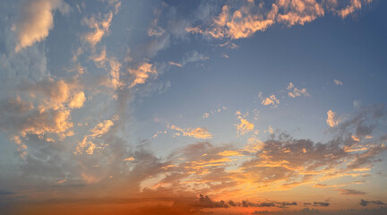 Panoramic sky background, sky with clouds. Golden summer sky, sunrise