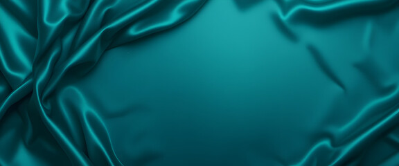 Beautiful green blue silk satin background. Wavy folds on shiny fabric. Luxury dark teal background with space for design. Web banner. Flat lay, table top view. Birthday, Christmas, Valentine