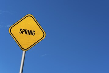Spring, yellow sign with blue sky