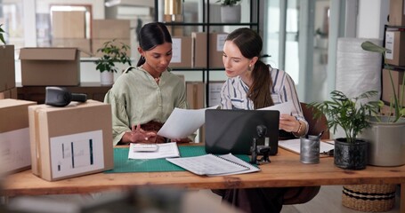 Box, documents and laptop for supply chain with women in delivery or distribution office together....