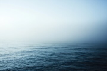 Obraz premium Serene Ocean Mist Enveloping Calm Waters