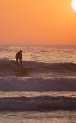 Obraz premium Sunset tiny waves