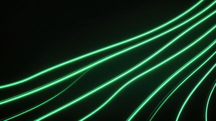 Fototapeta premium Green neon light trails flowing on black background