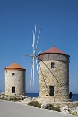 Windmills at Mandraki Harbour, Rhodes Town, Rhodes, Dodecanese, Greece, Europe