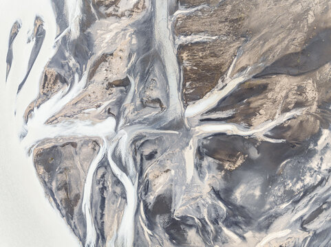 Abstract patterns in a river from a glacier.
