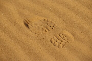 Human trace track in sand