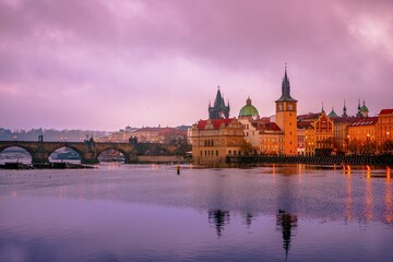 Obraz premium Vltava, Charles Bridge, Bridge Tower, historic centre, sunrise, morning mood, Prague, Bohemia, Czech Republic, Europe