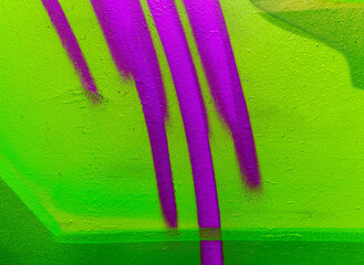 Beautiful colorful street art graffiti background. The wall is decorated with abstract drawings house paint. Modern style urban culture of street youth. Abstract picture on wall