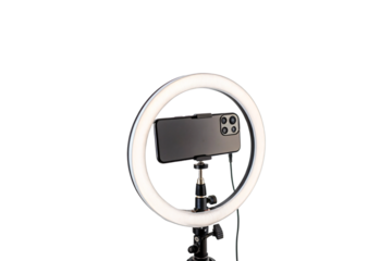 A glowing circular ring light illuminates a smartphone mounted in its center, showcasing essential equipment for photography, vlogging, isolated on a transparent background