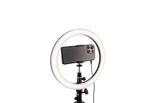 A glowing circular ring light illuminates a smartphone mounted in its center, showcasing essential equipment for photography, vlogging, isolated on a transparent background