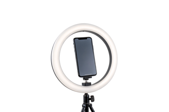 A smartphone stands vertically within a glowing ring light, highlighting the setup for vertical video recording or live streaming, isolated on a transparent background